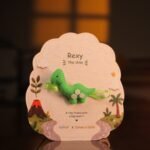 Nenolo Green Dinosaur Rakhi for kids with Keepsake Keychain