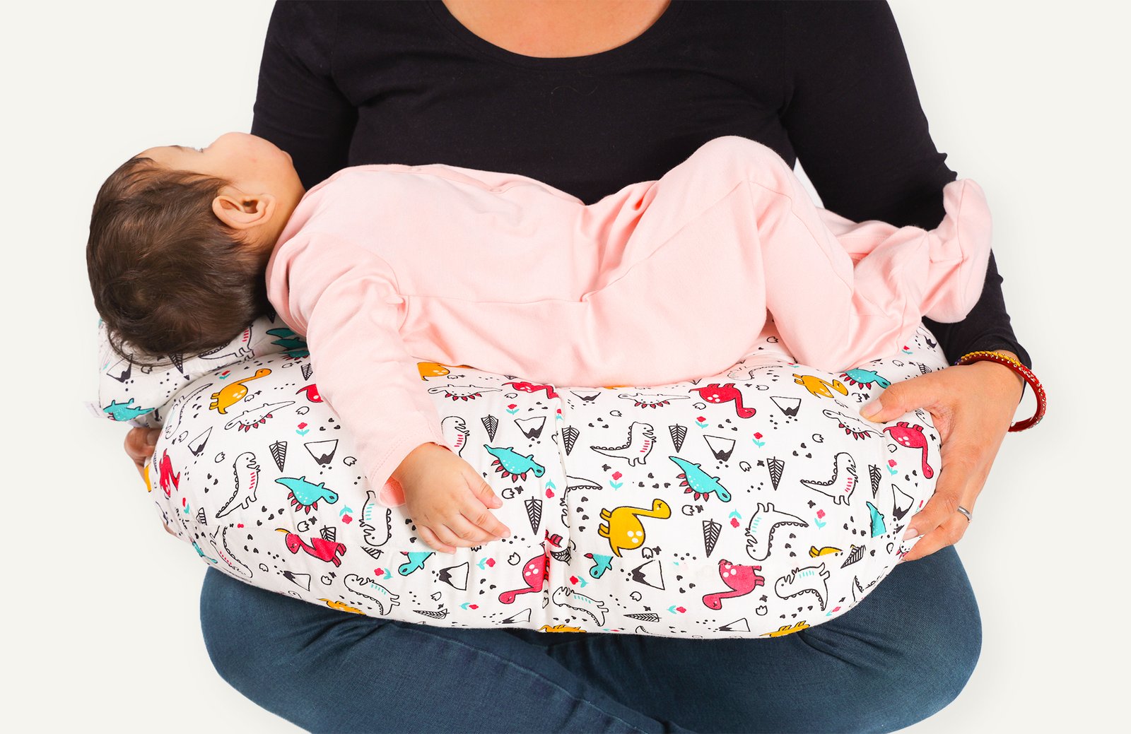 mother breast feeding new born using Nenolo Feeding Pillow